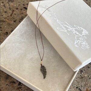 Feather on cord jes maharry necklace